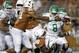 North Texas' Josh Greer (8) is sacked by Texas defenders Bryce Cottrell (91) and Hassan Ridgeway (98) during the second half of an NCAA college football game, Saturday, Aug. 30, 2014, in Austin, Texas. (AP Photo/Eric Gay)