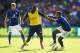 LEICESTER, ENGLAND - AUGUST 31: Yaya Sanogo of Arsenal is challenged by Liam Moore of Leicester City during the Barclays Premier League match between Leicester City and Arsenal at The King Power Stadium on August 31, 2014 in Leicester, England. (Photo by Laurence Griffiths/Getty Images)