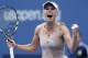 Caroline Wozniacki, of Denmark, reacts after defeating Maria Sharapova, of Russia, during the fourth round of the 2014 U.S. Open tennis tournament, Sunday, Aug. 31, 2014, in New York. (AP Photo/Kathy Willens)