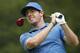 Rory McIlroy tees off on the fourth hole during the third round of the Deutsche Bank Championship golf tournament in Norton, Mass., Sunday, Aug. 31, 2014. (AP Photo/Michael Dwyer)