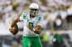 Oregon quarterback Marcus Mariota runs the football during the second quarter of an NCAA college football game against South Dakota in Eugene, Ore., Saturday, Aug. 30, 2014. (AP Photo/Ryan Kang)
