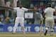 Sri Lanka's Rangana Herath, left, successfully appeals for the wicket of Pakistani batsman Younis Khan as non striker Asad Shafiq watches during the fourth day of their second test cricket match in Colombo, Sri Lanka, Sunday, Aug. 17, 2014. (AP Photo/Eranga Jayawardena)