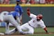 Cincinnati Reds' Billy Hamilton (6) is tagged out by Chicago Cubs shortstop Starlin Castro trying to steal second base in the third inning of a baseball game, Wednesday, July 9, 2014, in Cincinnati. (AP Photo/Al Behrman)