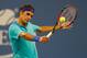 NEW YORK, NY - AUGUST 31: Roger Federer of Switzerland returns a shot to Marcel Granollers of Spain during their men's singles third round match on Day Seven of the 2014 US Open at the USTA Billie Jean King National Tennis Center on August 31, 2014 in the Flushing neighborhood of the Queens borough of New York City. (Photo by Mike Stobe/Getty Images for USTA)