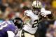 Aug 28, 2014; New Orleans, LA, USA; New Orleans Saints running back Mark Ingram (22) stiff arms Baltimore Ravens defensive back Chykie Brown (23) during the first quarter of a preseason game at Mercedes-Benz Superdome. Mandatory Credit: Derick E. Hingle-USA TODAY Sports