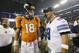 Denver Broncos quarterback Peyton Manning (18) and Dallas Cowboys quarterback Tony Romo (9) share a few words following a NFL preseason football game, Thursday, Aug. 28. 2014, in Arlington, Texas. (AP Photo/LM Otero)
