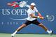Novak Djokovic plays a backhand shot during a third-round match at the 2014 U.S. Open.
