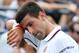 Novak Djokovic, of Serbia, wipes sweat from his face between points against Philipp Kohlschreiber, of Germany, during the fourth round of the 2014 U.S. Open tennis tournament, Monday, Sept. 1, 2014, in New York. (AP Photo/John Minchillo)