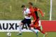 BURTON-UPON-TRENT, ENGLAND - FEBRUARY 18: Bradley Fewster of England challenged by David Henen of Belgium during the U18 International Friendly match between England and Belgium at St Georges Park on February 18, 2014 in Burton-upon-Trent, England. (Photo by Tony Marshall/Getty Images)