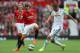 MANCHESTER, ENGLAND - AUGUST 16: Adnan Januzaj of Manchester United competes with Gylfi Sigurdsson of Swansea City during the Barclays Premier League match between Manchester United and Swansea City at Old Trafford on August 16, 2014 in Manchester, England. (Photo by Alex Livesey/Getty Images)