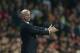 Newcastle United's manager Alan Pardew gestures to his players during their English Premier League soccer match between Arsenal and Newcastle United at the Emirates stadium in London, Monday, April 28, 2014. (AP Photo/Alastair Grant)