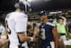 ADVANCE FOR WEEKEND EDITIONS, JAN. 25-26 - FILE - In this Aug. 17, 2013, file photo, Seattle Seahawks quarterback Russell Wilson (3) shakes hands with Denver Broncos quarterback Peyton Manning, left, after the Seahawks beat the Broncos 40-10 in preseason NFL football game in Seattle. The two teams are slated to meet in Super Bowl XLVIII on Sunday, Feb. 2, 2014, in East Rutherford, N.J. (AP Photo/John Froschauer, File)