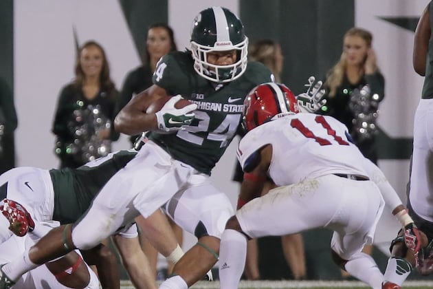 MSU Carrying Big Ten Flag to Oregon