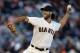 San Francisco Giants' Madison Bumgarner works against the Colorado Rockies in the first inning of a baseball game Tuesday, Aug. 26, 2014, in San Francisco. (AP Photo/Ben Margot)
