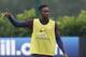 England's Danny Welbeck points during a training session at London Colney, Monday, Sept. 1, 2014. England will play Norway in an international friendly soccer match at Wembley Stadium on Wednesday. (AP Photo/Kirsty Wigglesworth)