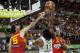 Brazil's Nene Hilario, center, shoots over Spain's Rudy Fernandez, left, and Serge Ibaka during the Group A Basketball World Cup match between Brazil and Spain in Granada, Spain, Monday, Sept. 1, 2014. The 2014 Basketball World Cup competition will take place in various cities in Spain from Aug. 30 through to Sept. 14. (AP Photo/Daniel Tejedor)