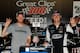 HAMPTON, GA - AUGUST 30: Kevin Harvick, driver of the #5 Bad Boy Buggies Chevrolet, and Dale Earnhardt Jr., owner of Jr. Motorsports, pose with the trophy in Victory Lane after winning the NASCAR Nationwide Series Great Clips 300 at Atlanta Motor Speedway on August 30, 2014 in Hampton, Georgia. (Photo by Jeff Curry/Getty Images)