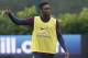 England's Danny Welbeck points during a training session at London Colney, Monday, Sept. 1, 2014. England will play Norway in an international friendly soccer match at Wembley Stadium on Wednesday. (AP Photo/Kirsty Wigglesworth)