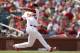 St. Louis Cardinals' Oscar Taveras hits an RBI single to score Jhonny Peralta during the seventh inning of a baseball game against the Milwaukee Brewers Sunday, Aug. 3, 2014, in St. Louis. The Cardinals won 3-2. (AP Photo/Jeff Roberson)