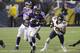 Minnesota Vikings running back Adrian Peterson (28) runs from Chicago Bears cornerback Tim Jennings (26) during overtime of an NFL football game, Sunday, Dec. 1, 2013, in Minneapolis. The Vikings won 23-20. (AP Photo/Ann Heisenfelt)