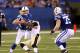 Aug 23, 2014; Indianapolis, IN, USA; Indianapolis Colts quarterback Andrew Luck (12) escapes a tackle by New Orleans Saints defensive end Cameron Jordan (94) at Lucas Oil Stadium. Mandatory Credit: Brian Spurlock-USA TODAY Sports