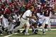Alabama head coach Nick Saban and the Crimson Tide take the field to warm up up before an NCAA college football game against West Virginia Saturday, Aug. 30, 2014, in Atlanta. (AP Photo/John Bazemore)