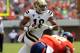 UCLA Bruins defensive back Jalen Ortiz (18) runs the ball in front of Virginia linebacker Tyler Shirley (42) during the second half of an NCAA college football game at Scott Stadium, Saturday, Aug. 30, 2014, in Charlottesville, Va. UCLA Bruins defeated Virginia 28-20. (AP Photo/Andrew Shurtleff)