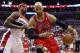 Chicago Bulls forward Taj Gibson (22) dries past Washington Wizards forward Al Harrington (7) during the first half of Game 4 of an opening-round NBA basketball playoff series in Washington, Sunday, April 27, 2014. (AP Photo/Alex Brandon)