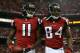 ATLANTA, GA - JANUARY 20: Wide receiver Julio Jones #11 and wide receiver Roddy White #84 of the Atlanta Falcons celebrate after Jones catches a 20-yard touchdown catch in the second quarter against the San Francisco 49ers in the NFC Championship game at the Georgia Dome on January 20, 2013 in Atlanta, Georgia. (Photo by Streeter Lecka/Getty Images)