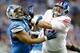 DETROIT, MI - DECEMBER 22: Ndamukong Suh #90 of the Detroit Lions and Justin Pugh #72 of the New York Giants battle during the second quarter of the game at Ford Field on December 22, 2013 in Detroit, Michigan. The Giants defeated the Lions 23-20 in overtime. (Photo by Leon Halip/Getty Images)