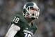 FILE - In this Nov. 2, 2013, file photo, Michigan State quarterback Connor Cook yells in celebration after scoring a touchdown against Michigan during an NCAA college football game, in East Lansing, Mich. Cook finished the 2013 season strong, throwing for 304 yards and three touchdowns against Ohio State in the Big Ten championship game and for a career-high 332 yards and two TDs against Stanford while being named Offensive MVP of the Rose Bowl. (AP Photo/Al Goldis)