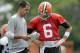 Cleveland Browns offensive coordinator Kyle Shanahan calls the play for quarterback Brian Hoyer (6) during NFL football training camp, Saturday, July 26, 2014, in Berea, Ohio. (AP Photo/Mark Duncan)