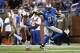 Detroit Lions wide receiver Calvin Johnson (81) runs for yardage after a catch against the Tampa Bay Buccaneers during the fourth quarter of an NFL football game at Ford Field in Detroit, Sunday, Nov. 24, 2013. (AP Photo/Paul Sancya)