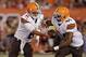 Cleveland Browns quarterback Brian Hoyer (6) hands off to running back Ben Tate (44) in the first quarter of a preseason NFL football game against the St. Louis Rams Saturday, Aug. 23, 2014, in Cleveland. (AP Photo/Tony Dejak)