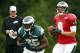 Philadelphia Eagles quarterback Nick Foles (9) runs a drill with running back LeSean McCoy (25) during NFL football training camp Friday, Aug. 1, 2014, in Philadelphia. (AP Photo/Matt Rourke)