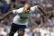 West Ham United's Mark Noble, left, competes for the ball with Tottenham Hotspur's Younes Kaboul during their English Premier League soccer match at Upton Park, London, Saturday, Aug. 16, 2014. (AP Photo/Sang Tan)