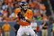 Denver Broncos quarterback Peyton Manning (18) throws against the Houston Texans during the first half of an NFL preseason football game, Saturday, Aug. 23, 2014, in Denver. (AP Photo/Joe Mahoney)