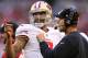 GLENDALE, AZ - DECEMBER 29: (L-R) Colin Kaepernick #7 of the San Francisco 49ers talks with head coach Jim Harbaugh on the sidelines against the Arizona Cardinals during a game at University of Phoenix Stadium on December 29, 2013 in Glendale, Arizona. (Photo by Christian Petersen/Getty Images)
