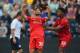 PRESTON, LANCASHIRE - JULY 19: Suso of Liverpool celebrates scoring with team mate Jordan Ibe during the pre season friendly match between Preston North End and Liverpool at Deepdale on July 19, 2014 in Preston, Lancashire. (Photo by Michael Regan/Getty Images)
