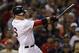 Boston Red Sox' Will Middlebrooks swings through on a double as he breaks up a no-hitter by Los Angeles Angels starting pitcher Matt Shoemaker during the seventh inning of a baseball game at Fenway Park in Boston, Thursday, Aug. 21, 2014. (AP Photo/Charles Krupa)