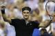 Roger Federer, of Switzerland, raises his arms after defeating Roberto Bautista Agut, of Spain, 6-4, 6-3, 6-2 during the fourth round of the U.S. Open tennis tournament, Tuesday, Sept. 2, 2014, in New York. (AP Photo/Charles Krupa)