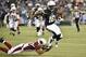 San Diego Chargers wide receiver Seyi Ajirotutu escapes from Arizona Cardinals defensive back Bryan McCann during the first half of an NFL preseason football game Thursday, Aug. 28, 2014, in San Diego. (AP Photo/Denis Poroy)
