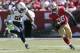 San Francisco 49ers running back Carlos Hyde (28) runs from San Diego Chargers outside linebacker Tourek Williams (58) during the second quarter of an NFL preseason football game in Santa Clara, Calif., Sunday, Aug. 24, 2014. (AP Photo/Marcio Jose Sanchez)