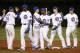 The Chicago Cubs celebrate the team's 7-1 win over the Milwaukee Brewers after a baseball game Tuesday, Sept. 2, 2014, in Chicago. (AP Photo/Charles Rex Arbogast)