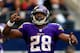 ARLINGTON, TX - NOVEMBER 03: Running back Adrian Peterson #28 of the Minnesota Vikings celebrates after a touchdown during the game against the Dallas Cowboys at Cowboys Stadium on November 3, 2013 in Arlington, Texas. (Photo by Jamie Squire/Getty Images)