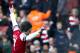 Arsenal's Tomas Rosicky, raises his arms after scoring against Sunderland, during their English Premier League soccer match, at the Emirates Stadium, in London, Saturday, Feb. 22, 2014. (AP Photo/Bogdan Maran)