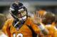 Denver Broncos quarterback Peyton Manning (18) waves to a fan in the first half of a NFL preseason football game against the Dallas Cowboys, Thursday, Aug. 28. 2014, in Arlington, Texas. (AP Photo/LM Otero)