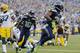 Seattle Seahawks' Marshawn Lynch, right, scores a touchdown in the first half of an NFL football game against the Green Bay Packers, Thursday, Sept. 4, 2014, in Seattle. (AP Photo/Scott Eklund)