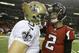 New Orleans Saints quarterback Drew Brees (9) speaks with Atlanta Falcons quarterback Matt Ryan (2) after the second half of an NFL football game, Thursday, Nov. 21, 2013, in Atlanta. The New Orleans Saints won 17-13. (AP Photo/David Goldman)