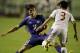 The Philippines' Daisuke Sato (3) and Taiwan's Li Mao (11) battle for the ball during the Peace Cup 2014 soccer friendly match Wednesday, Sept.3, 2014 at the rain-soaked Rizal Memorial Football Stadium in Manila, Philippines. (AP Photo/Bullit Marquez)